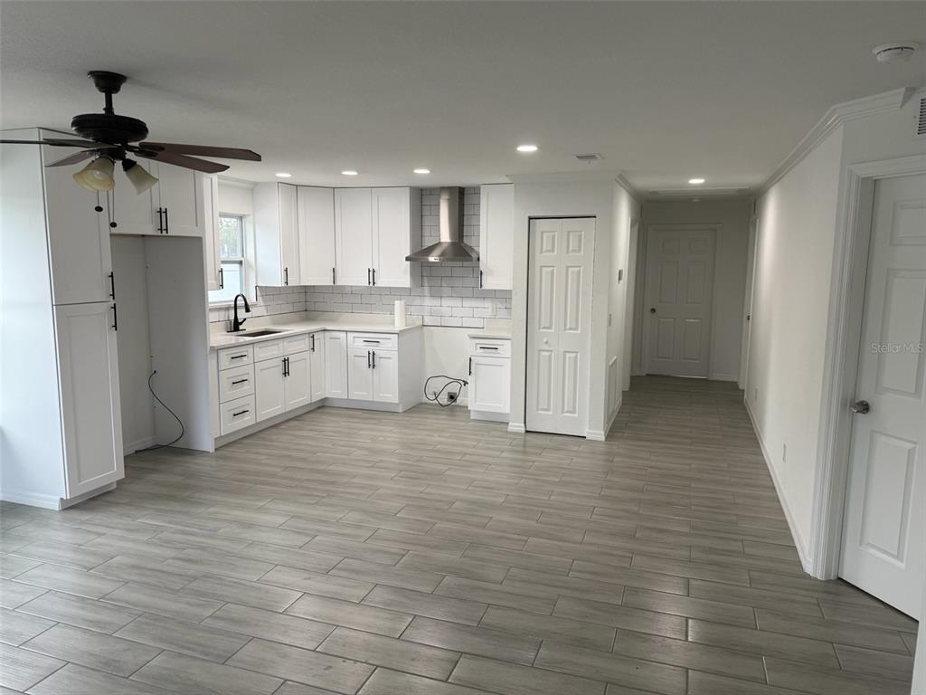89 West Imogene Street Arcadia, FL 34266 - Photo 5 of 18 a kitchen with stainless steel appliances a refrigerator and a stove top oven