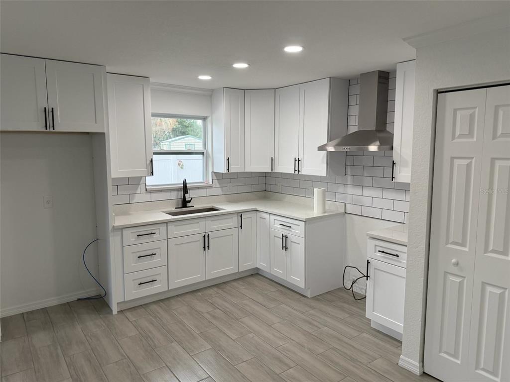 89 West Imogene Street Arcadia, FL 34266 - Photo 6 of 18 a kitchen with white cabinets sink and appliances