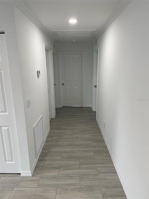 89 West Imogene Street Arcadia, FL 34266 - Photo 7 of 18 a view of a hallway with wooden floor