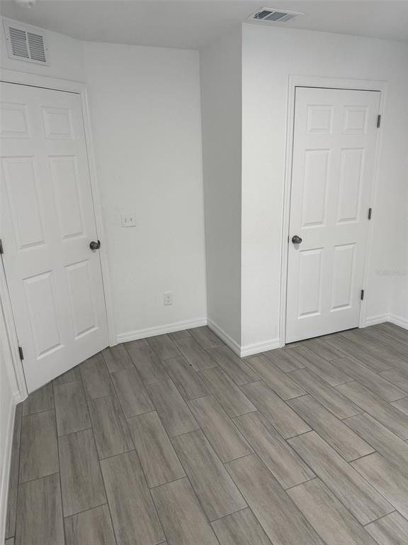 89 West Imogene Street Arcadia, FL 34266 - Photo 9 of 18 a view of an empty room with wooden floor
