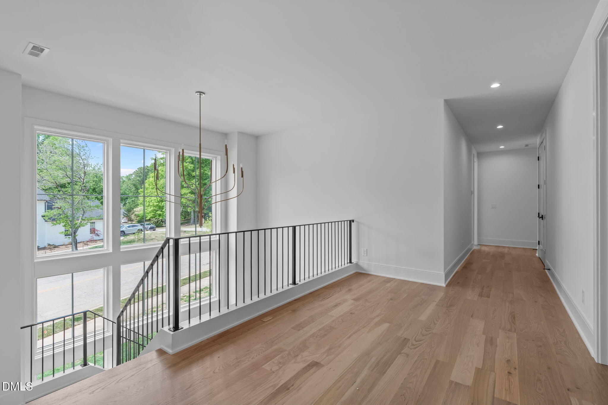 7917 South Bridgewater Court Raleigh, NC 27615 - Photo 43 of 67 a view of hallway with wooden floor