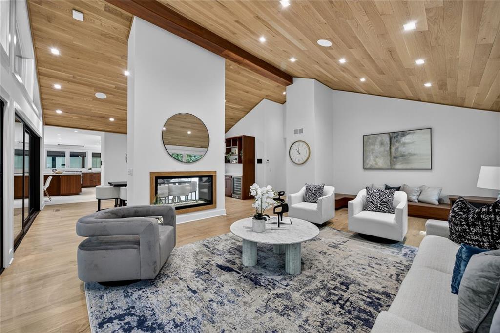 585 Amberidge Trail Northwest Atlanta, GA 30328 - Photo 14 of 103 a living room with fireplace furniture and a wooden floor