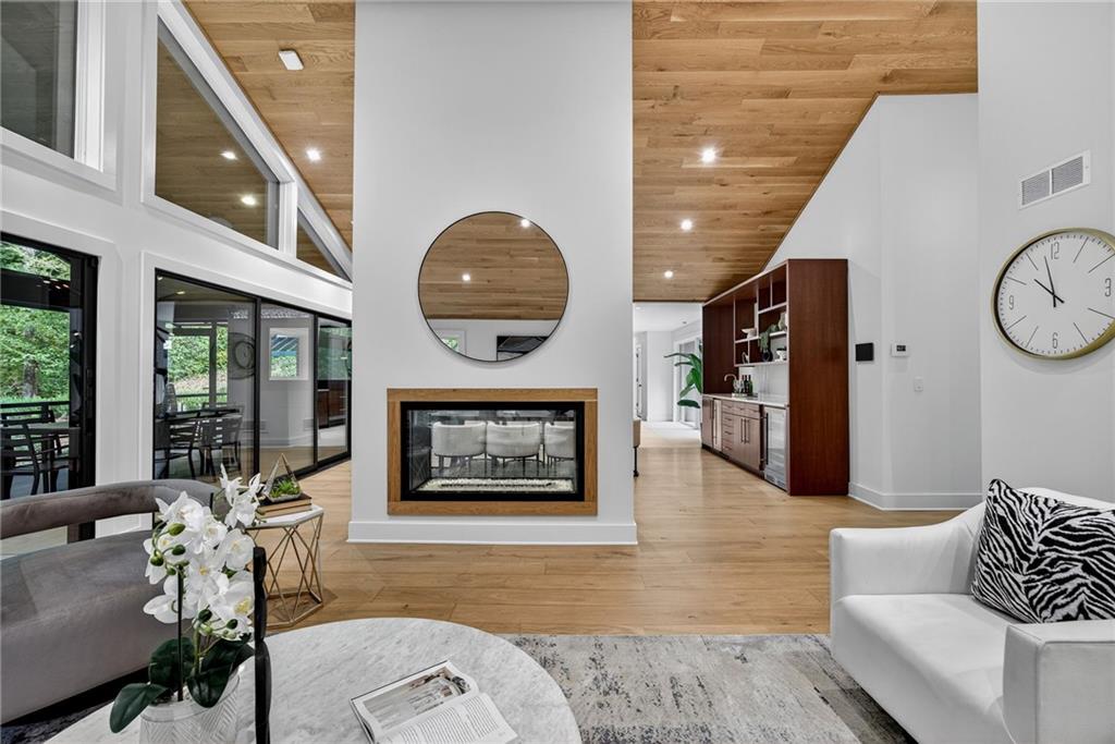 585 Amberidge Trail Northwest Atlanta, GA 30328 - Photo 16 of 103 a living room with furniture and a large window