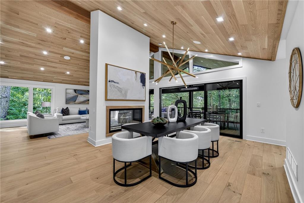 585 Amberidge Trail Northwest Atlanta, GA 30328 - Photo 17 of 103 a living room with furniture fireplace and a large window