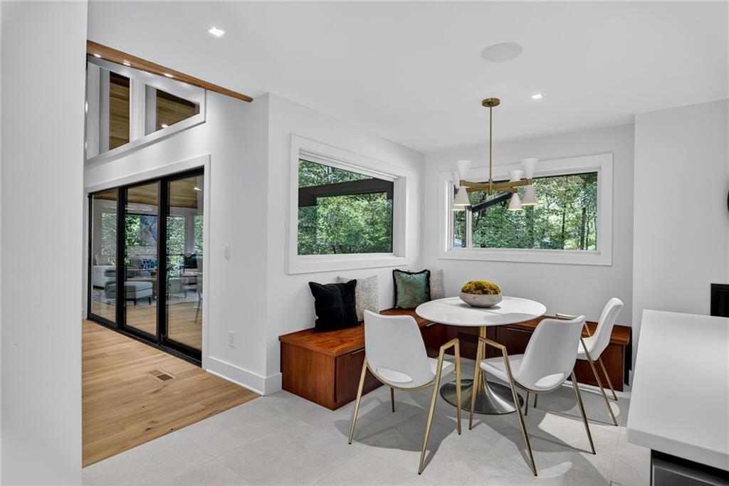 585 Amberidge Trail Northwest Atlanta, GA 30328 - Photo 25 of 85 a view of a dining room with furniture window and outside view