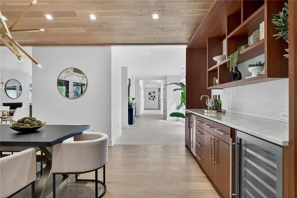 a bedroom with a bed and a large mirror