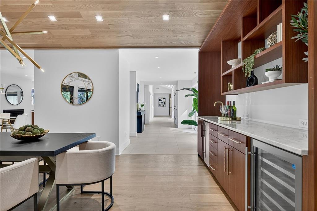 585 Amberidge Trail Northwest Atlanta, GA 30328 - Photo 26 of 103 a kitchen with stainless steel appliances granite countertop a sink and a stove
