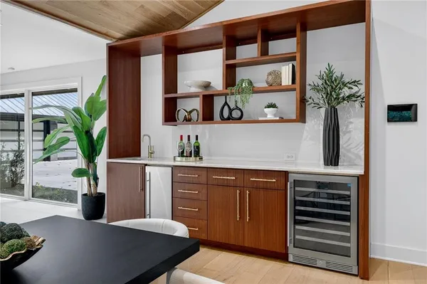 a bedroom with a large bed and a large window