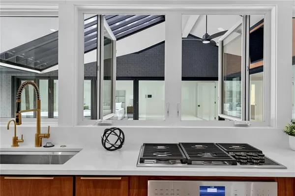 a view of room with window and ceiling fan