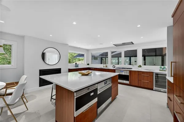a view of a hallway with wooden floor and stairs