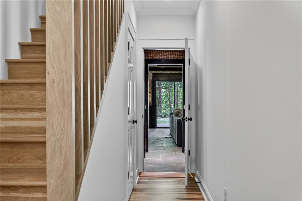 585 Amberidge Trail Northwest Atlanta, GA 30328 - Photo 43 of 85 a view of a hallway with wooden floor and entryway