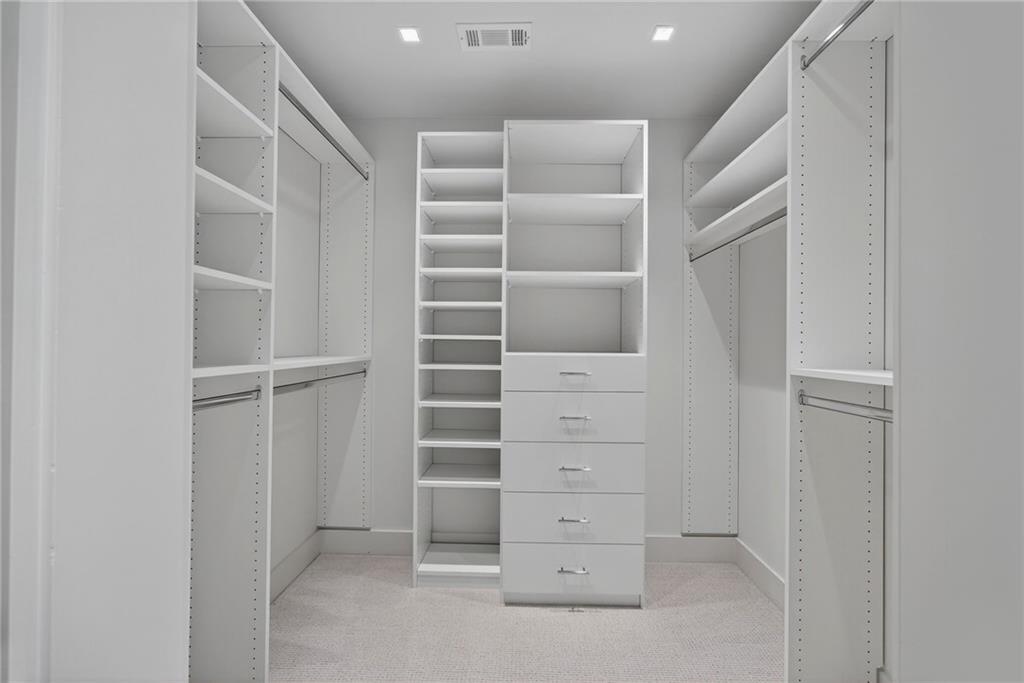 585 Amberidge Trail Northwest Atlanta, GA 30328 - Photo 47 of 103 a view of walk in closet with empty racks