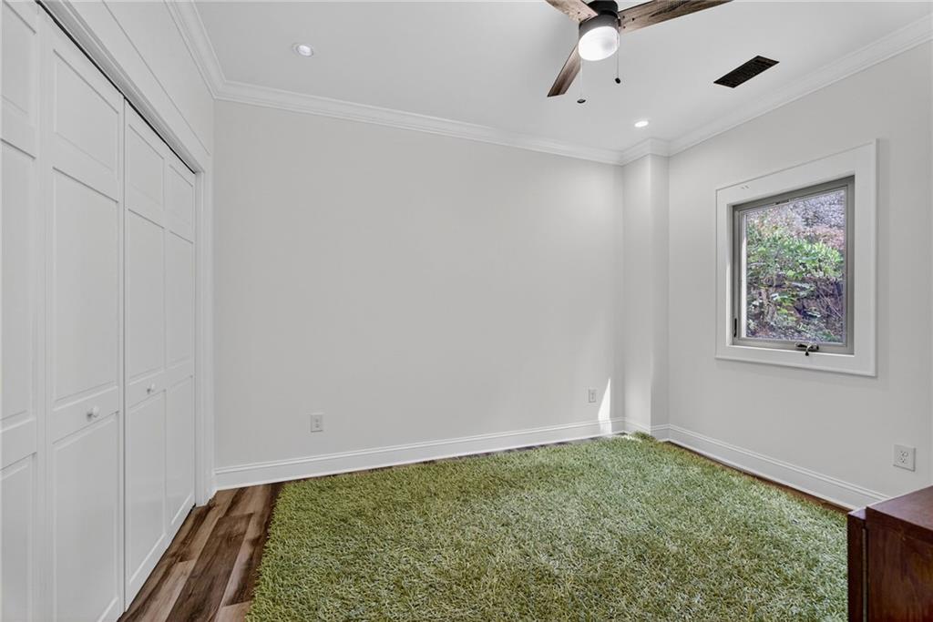 585 Amberidge Trail Northwest Atlanta, GA 30328 - Photo 52 of 85 a view of room with window and ceiling fan