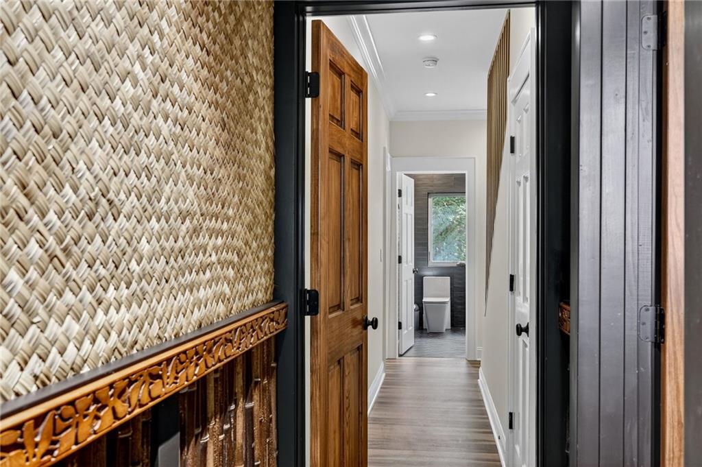 585 Amberidge Trail Northwest Atlanta, GA 30328 - Photo 68 of 103 a view of a hallway with wooden floor and stairs