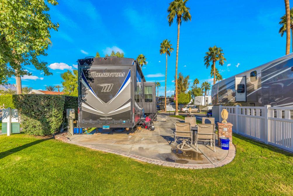 69411 Ramon Road, Unit 1158 Cathedral City, CA 92234 - Photo 14 of 18 a view of swimming pool with a patio and a yard
