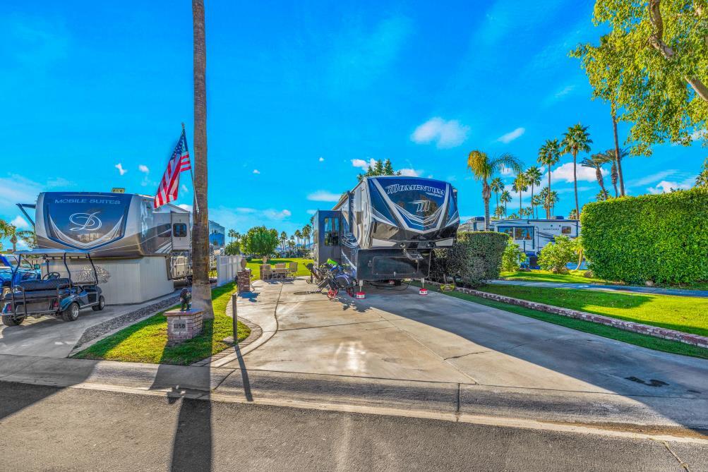 69411 Ramon Road, Unit 1158 Cathedral City, CA 92234 - Photo 5 of 18 a view of a swimming pool with a patio