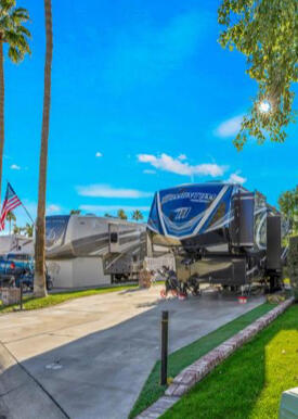 69411 Ramon Road, Unit 1158 Cathedral City, CA 92234 - Photo 6 of 18 a view of a backyard with a table and chairs