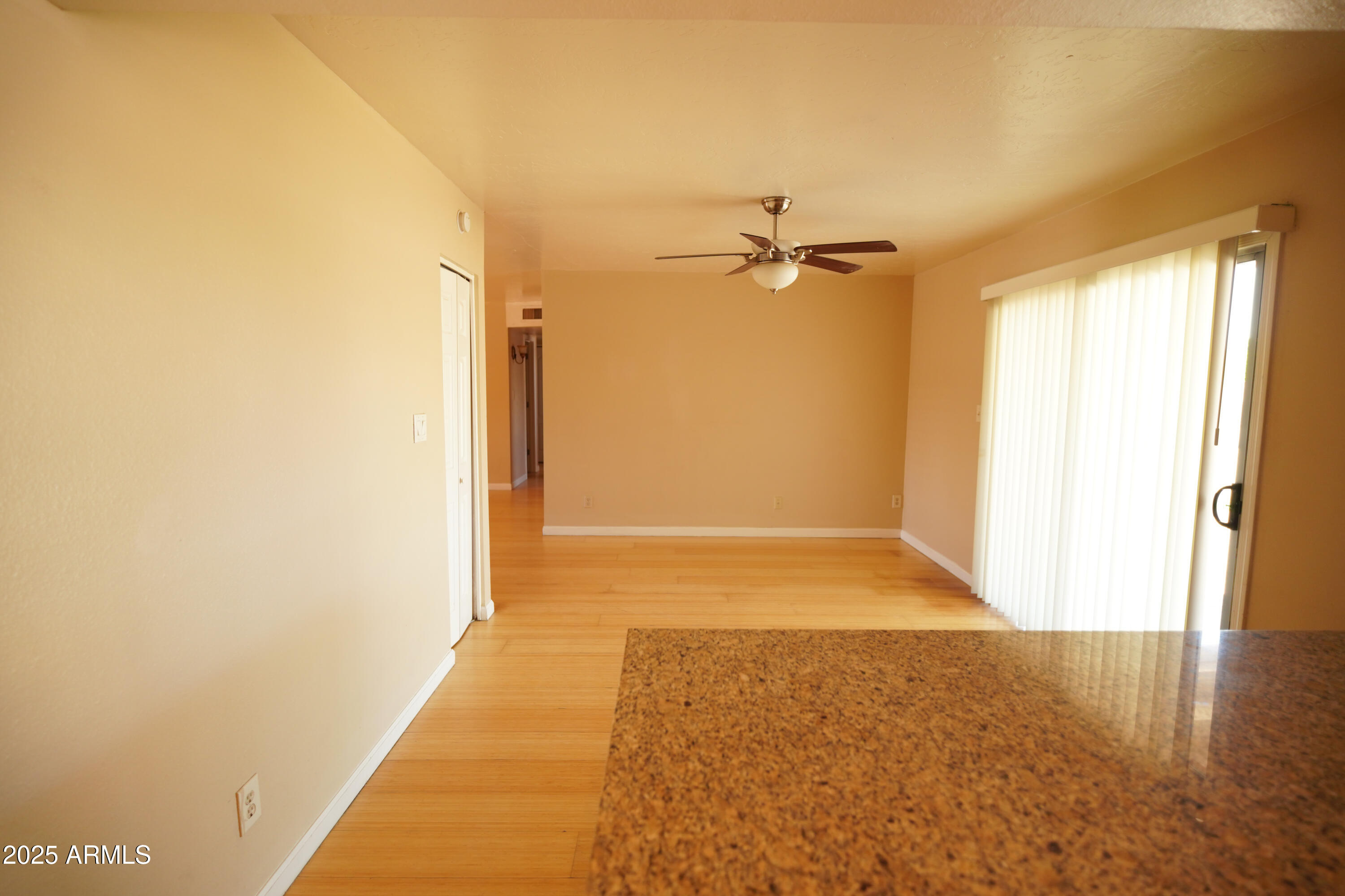 2620 West Irisado Circle Mesa, AZ 85202 - Photo 4 of 11 a view of hallway with a large window and chandelier