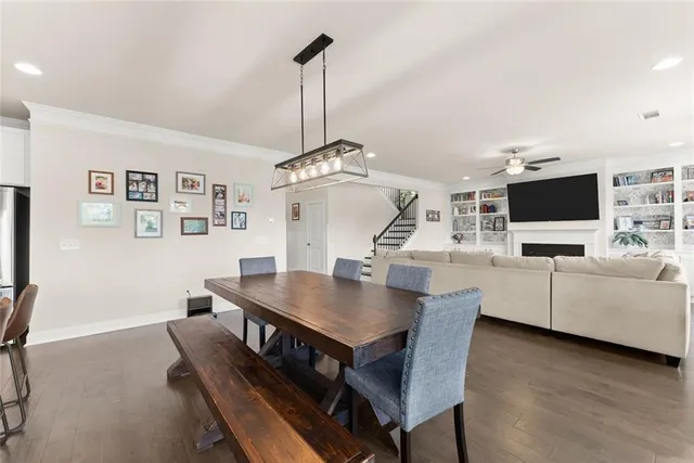 a view of a livingroom with furniture and a flat screen tv