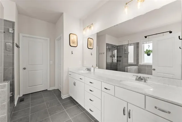 a white bath tub sitting next to a shower
