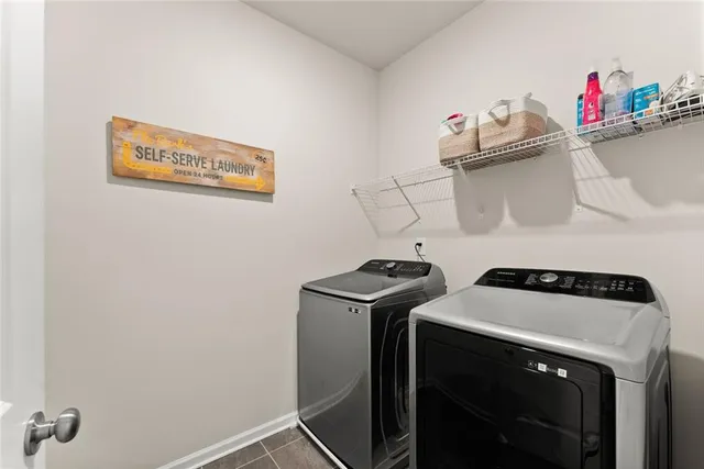 a bedroom with a bed and a potted plant