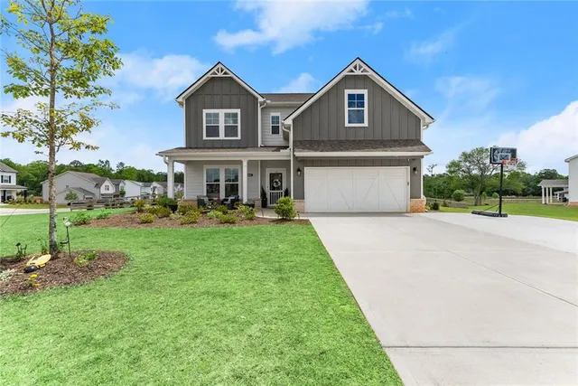 a front view of a house with a yard