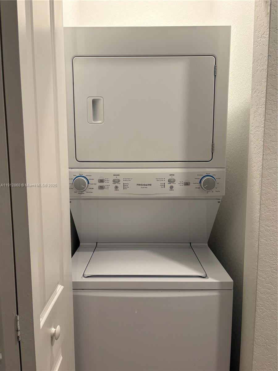 12221 Northwest 23rd Place Miami, FL 33167 - Photo 11 of 19 a close up view of washer and dryer