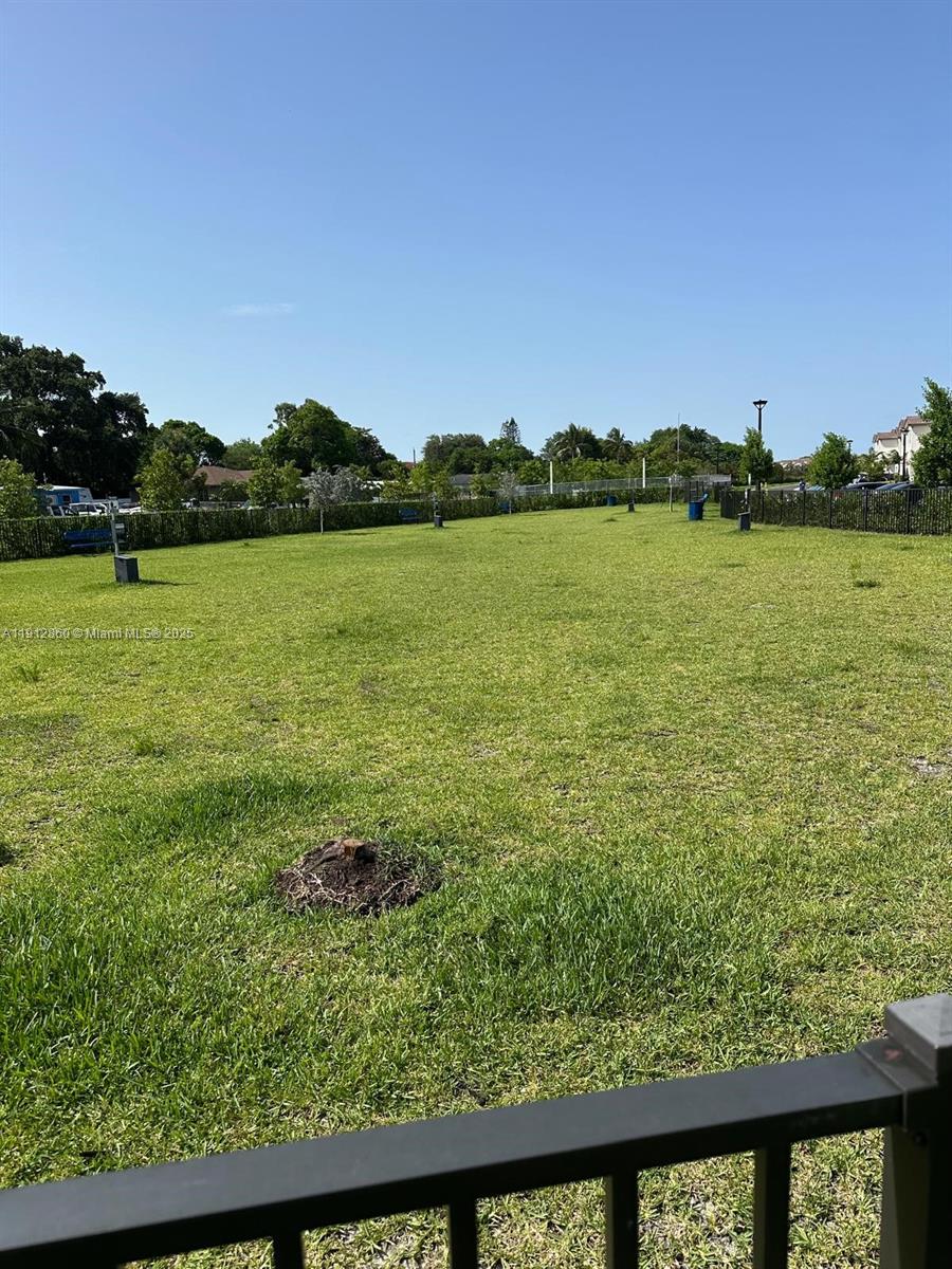 12221 Northwest 23rd Place Miami, FL 33167 - Photo 14 of 19 a view of a lake from a balcony