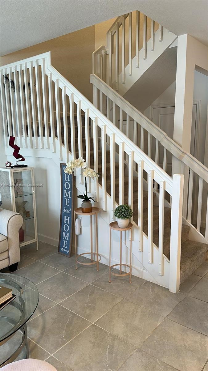 12221 Northwest 23rd Place Miami, FL 33167 - Photo 5 of 19 a view of an entryway with staircase