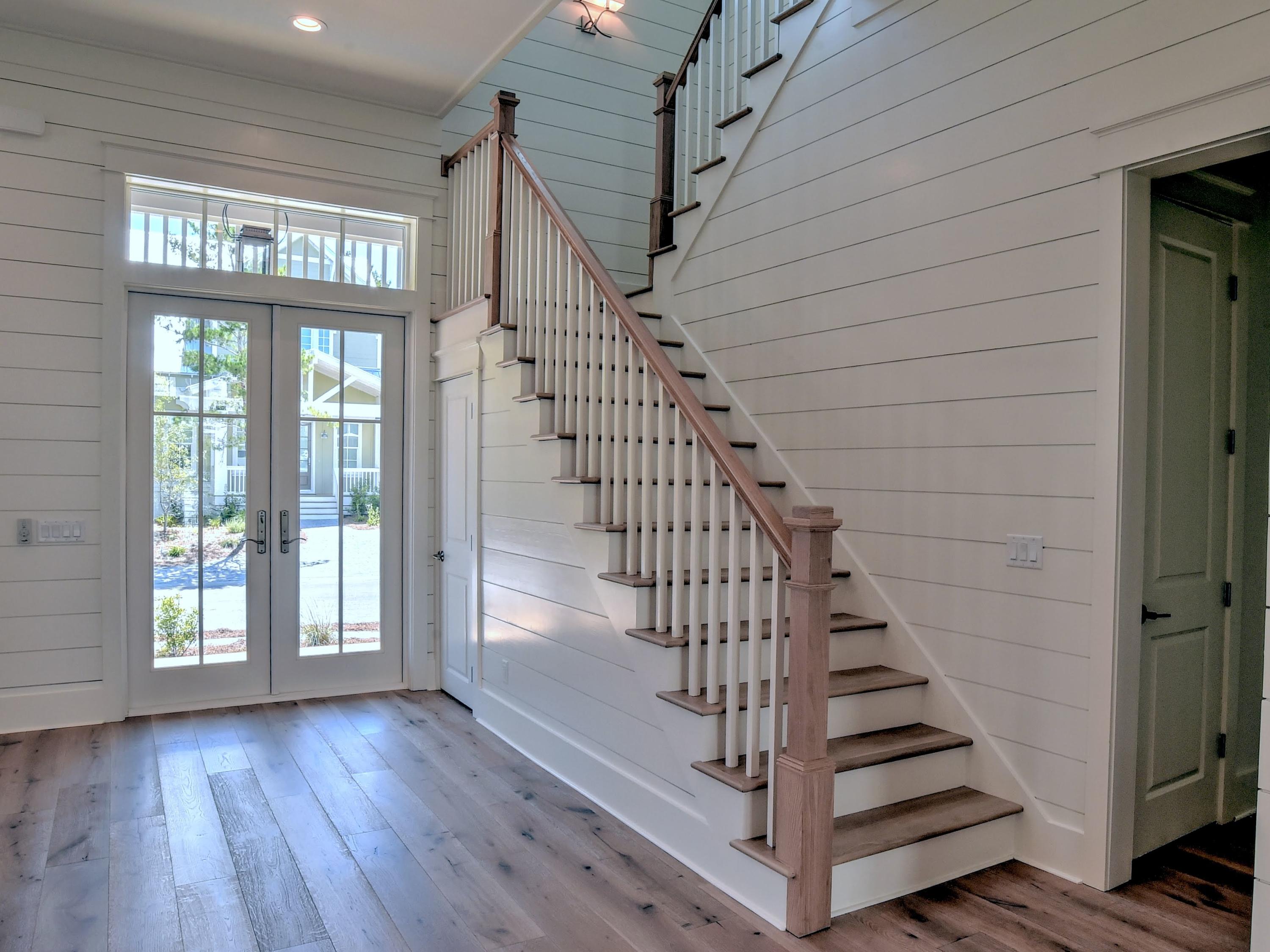 237 Cabana Trail Santa Rosa Beach, FL 32459 - Photo 12 of 27 a view of entryway with stairs and wooden floor