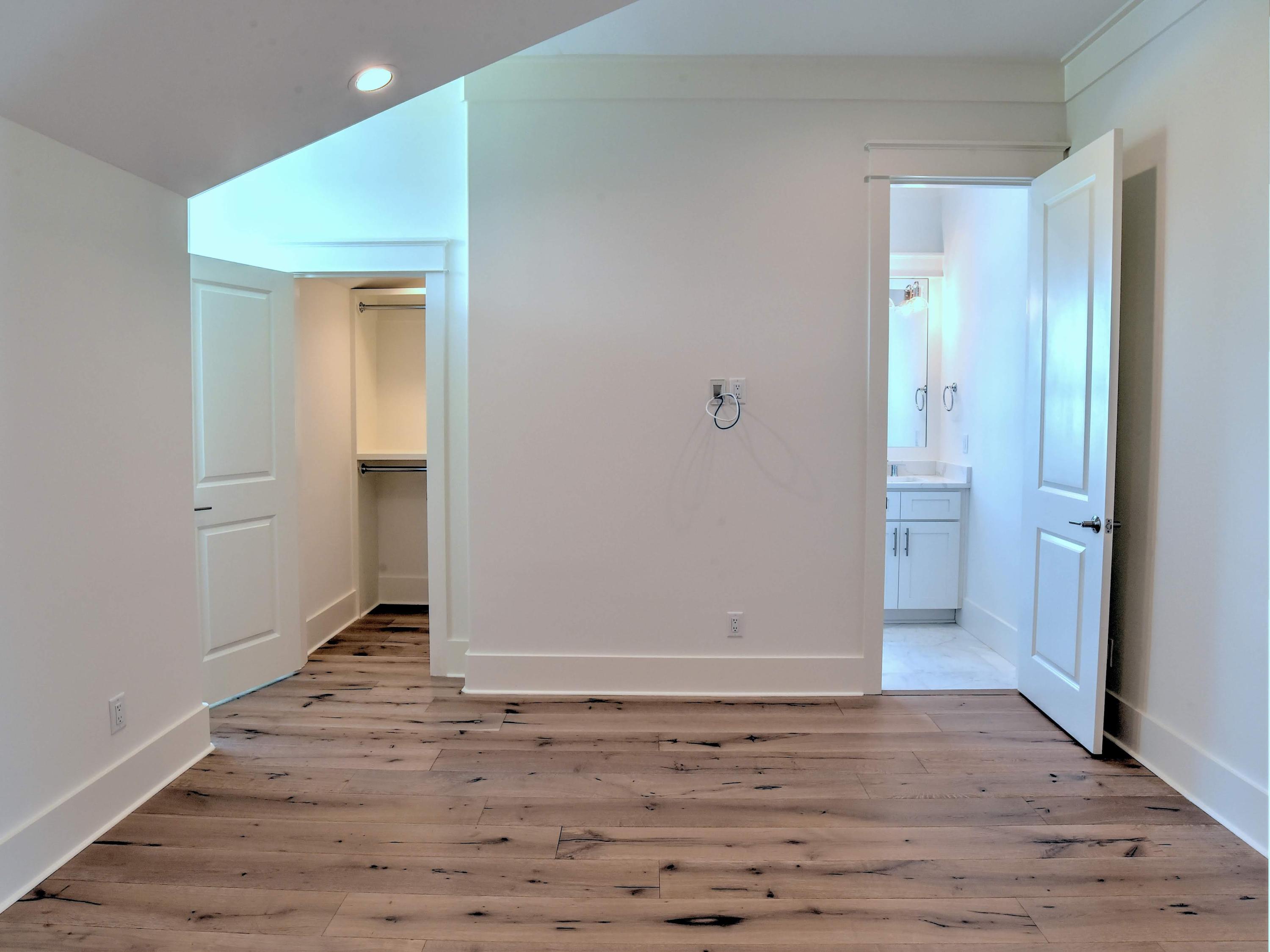 237 Cabana Trail Santa Rosa Beach, FL 32459 - Photo 16 of 27 an empty room with wooden floor and entrance