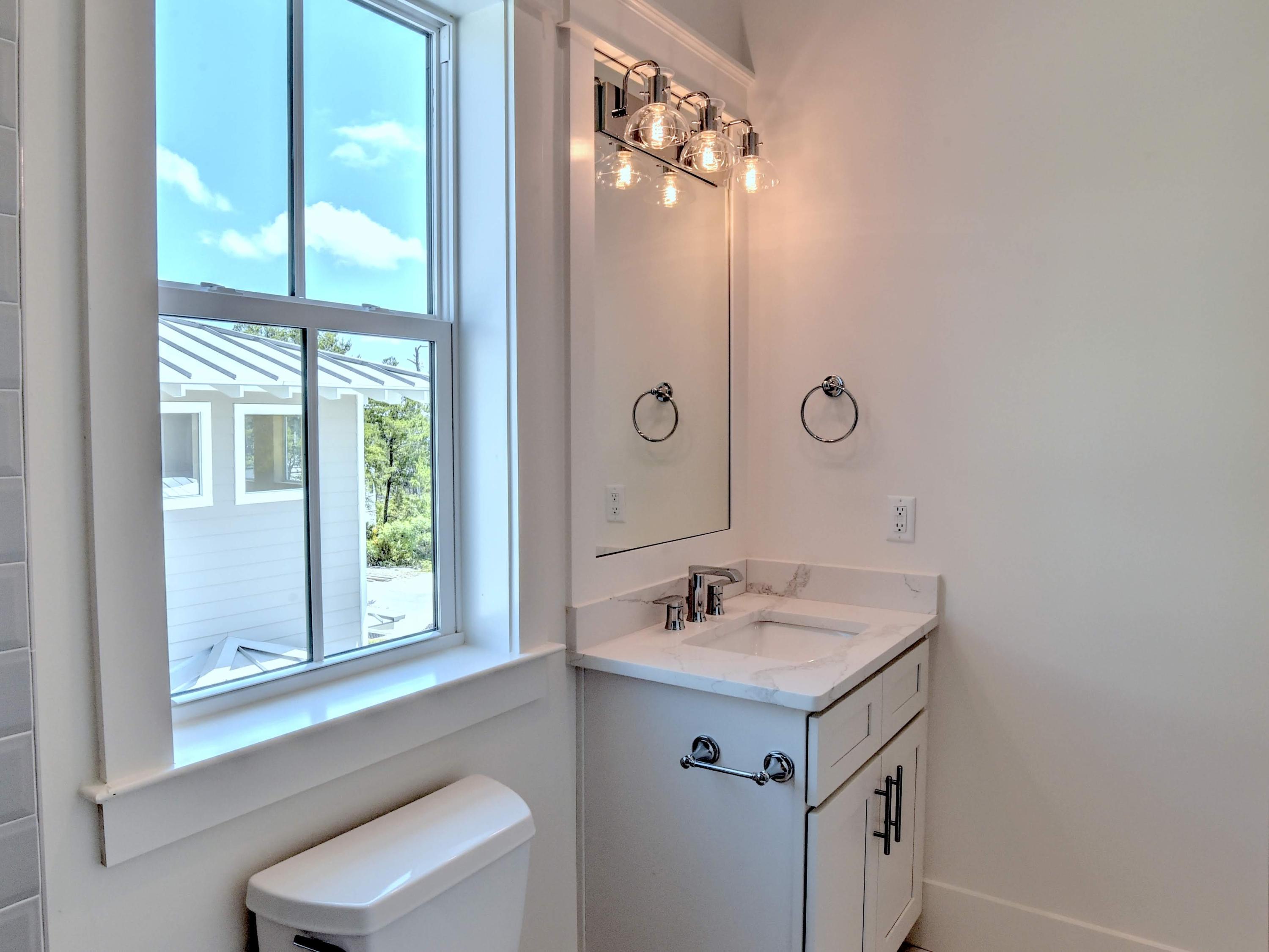 237 Cabana Trail Santa Rosa Beach, FL 32459 - Photo 17 of 27 a bathroom with a sink and a mirror