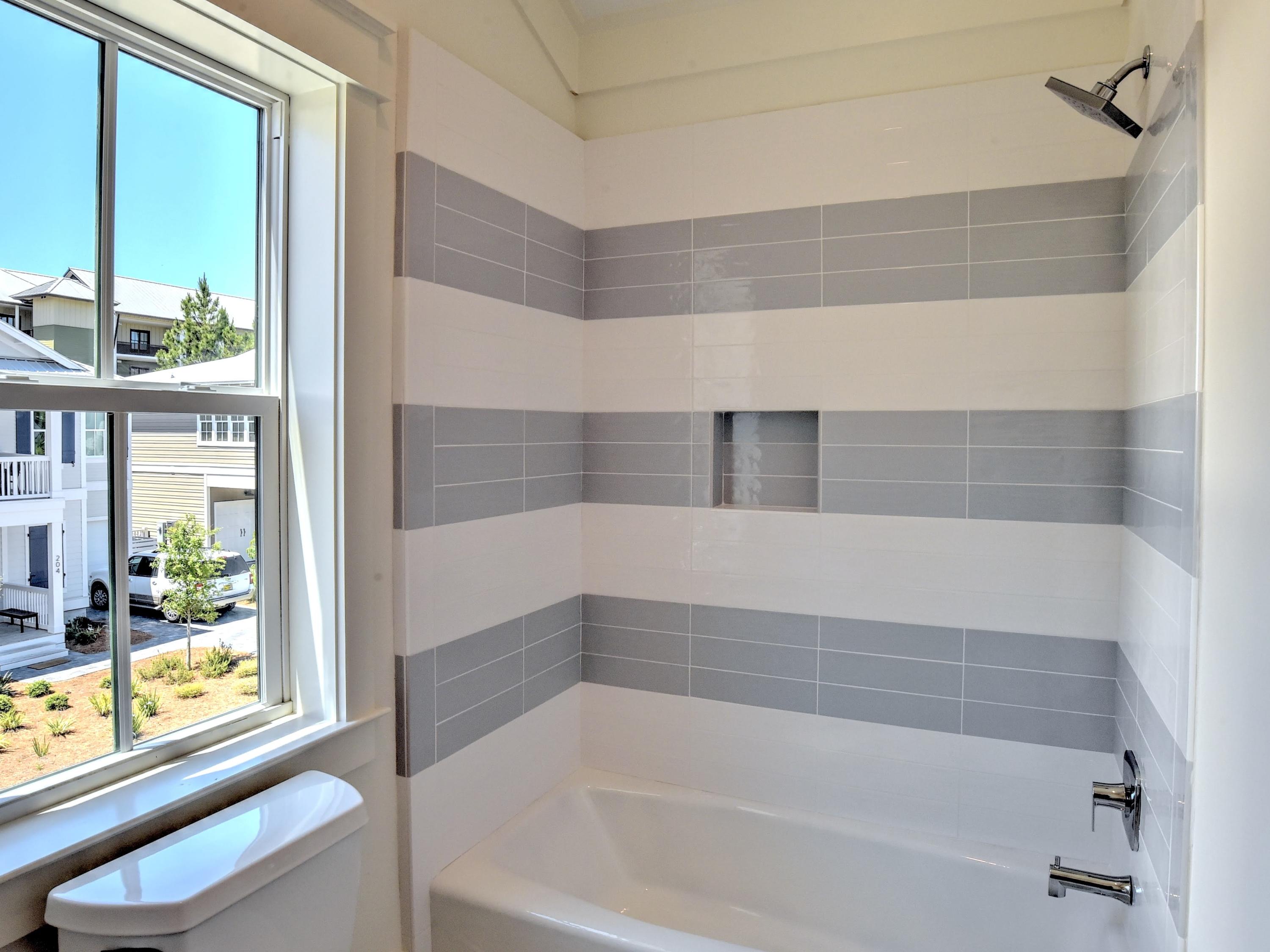 237 Cabana Trail Santa Rosa Beach, FL 32459 - Photo 20 of 27 a bathroom with bathtub and window
