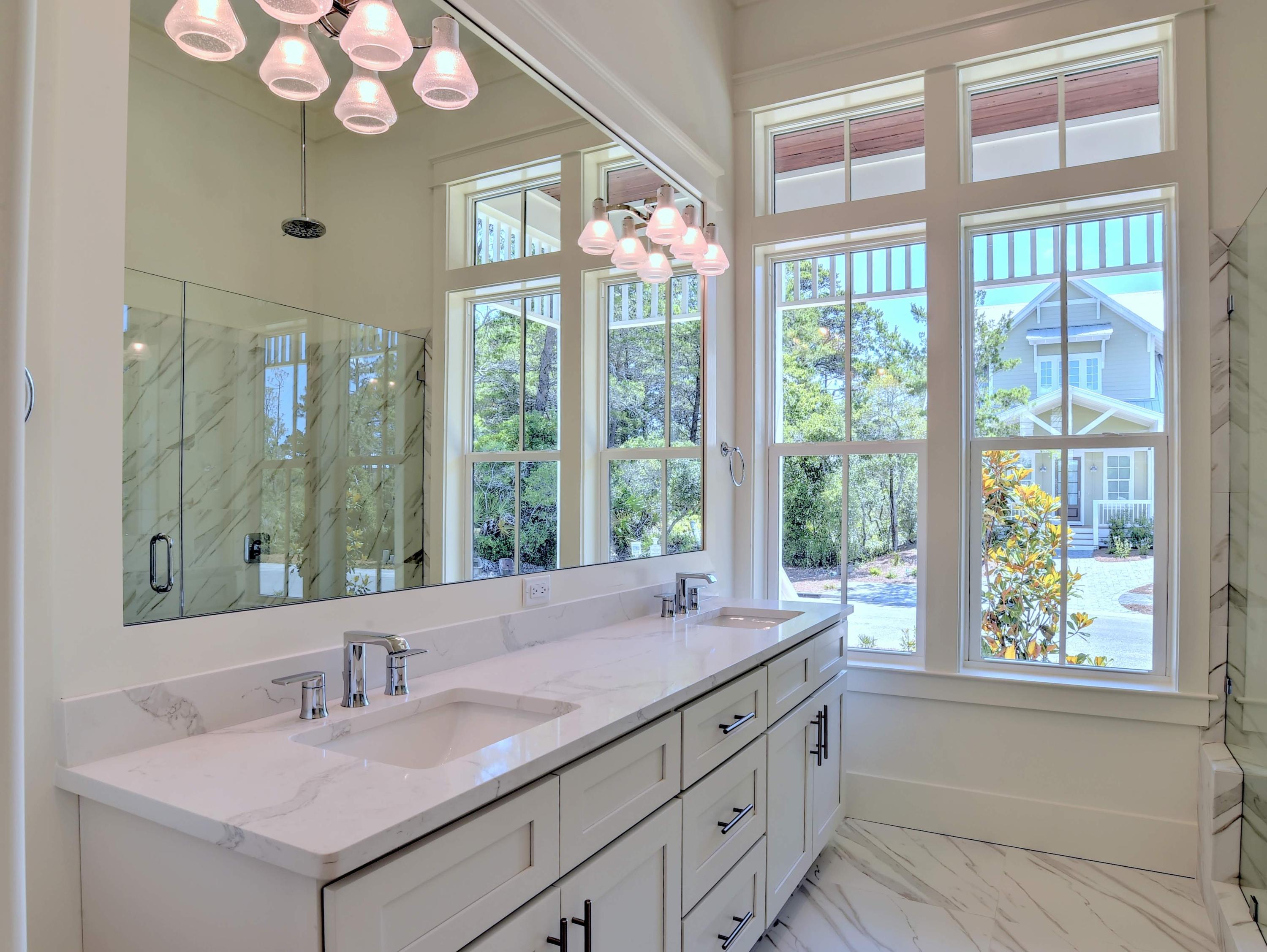 237 Cabana Trail Santa Rosa Beach, FL 32459 - Photo 9 of 27 a bathroom with a sink and a large mirror