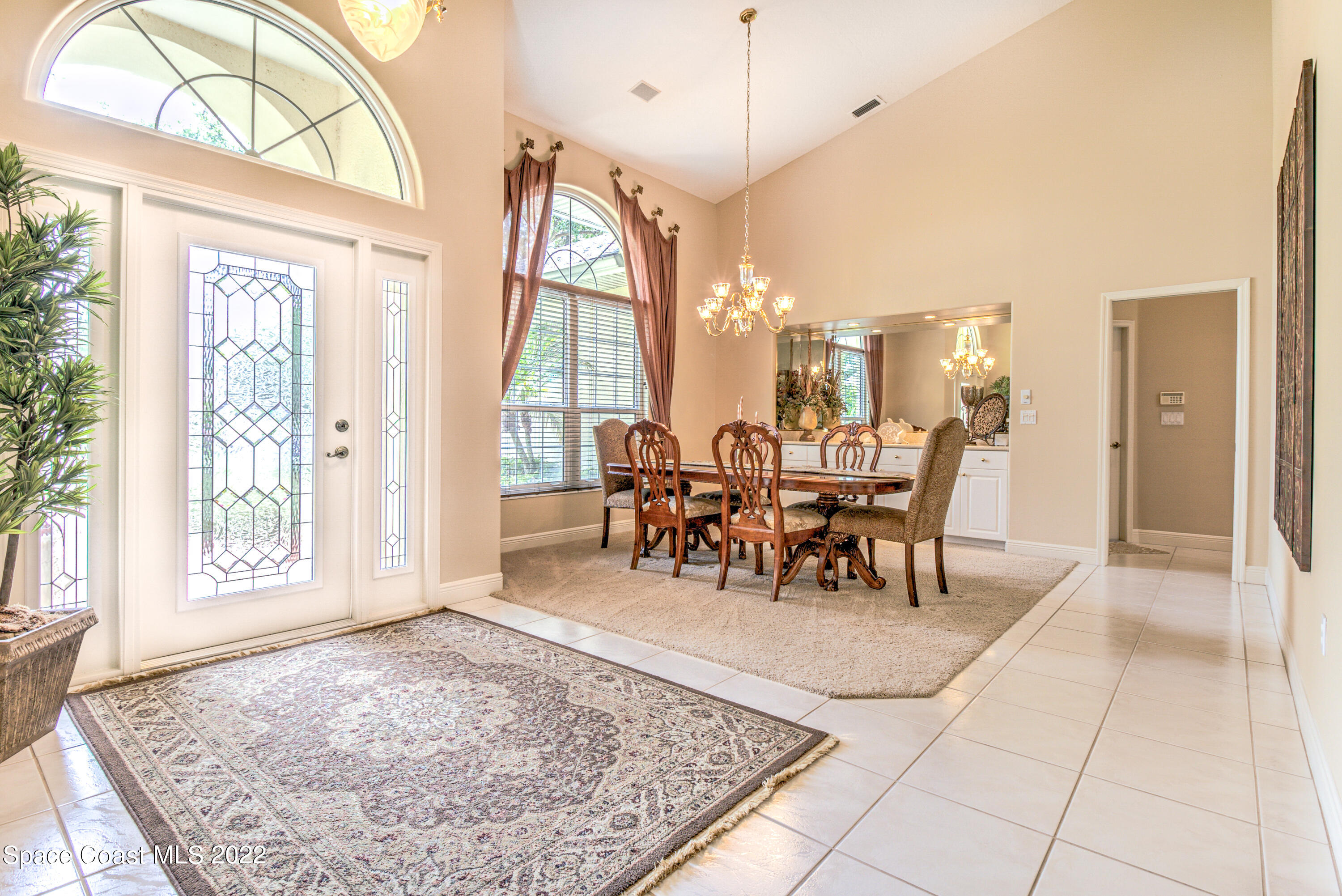 3415 Shady Run Road Melbourne, FL 32934 - Photo 4 of 45 a view of a dining room with furniture window and outside view