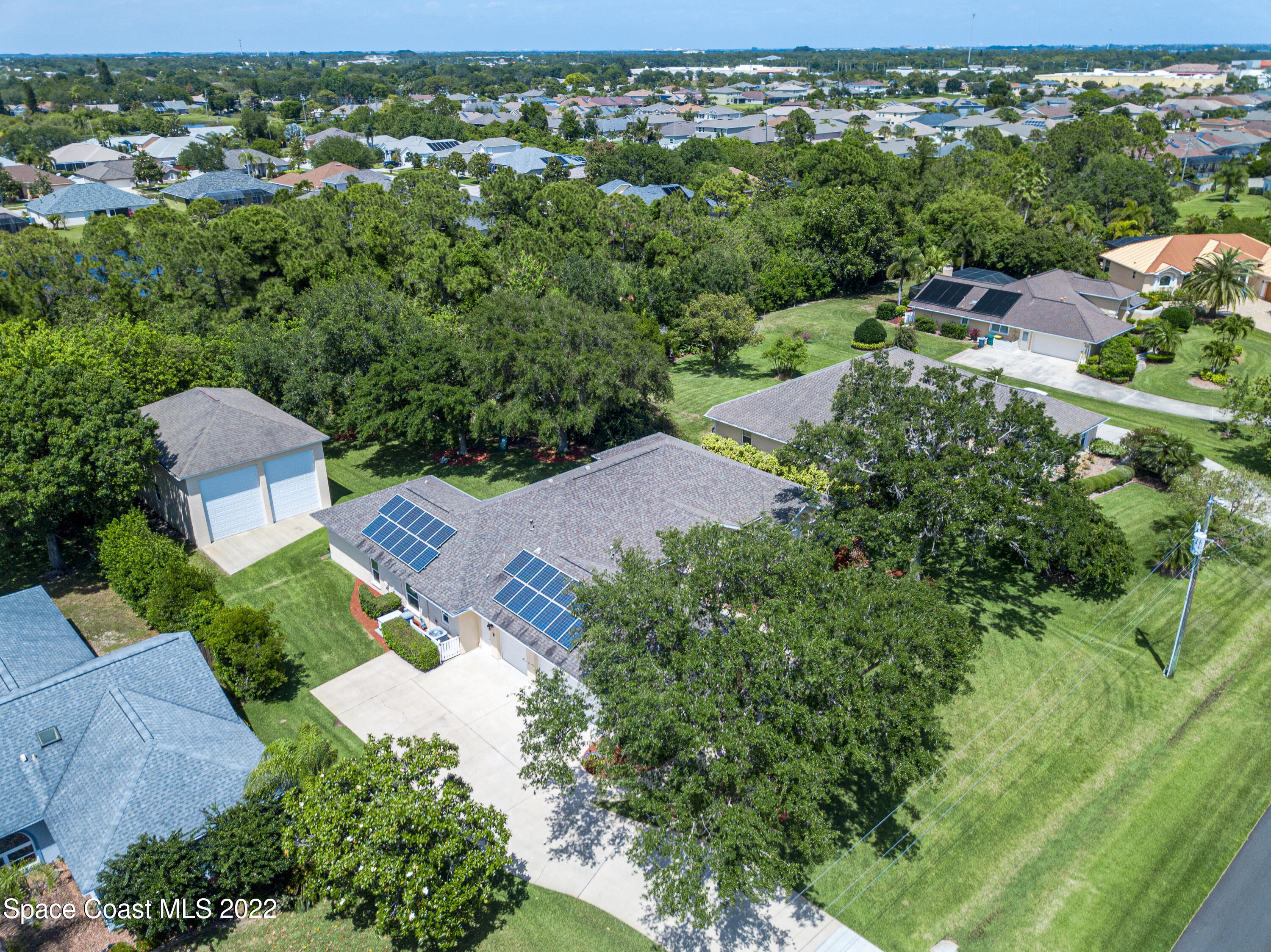 3415 Shady Run Road Melbourne, FL 32934 - Photo 41 of 45 an aerial view of residential houses with outdoor space