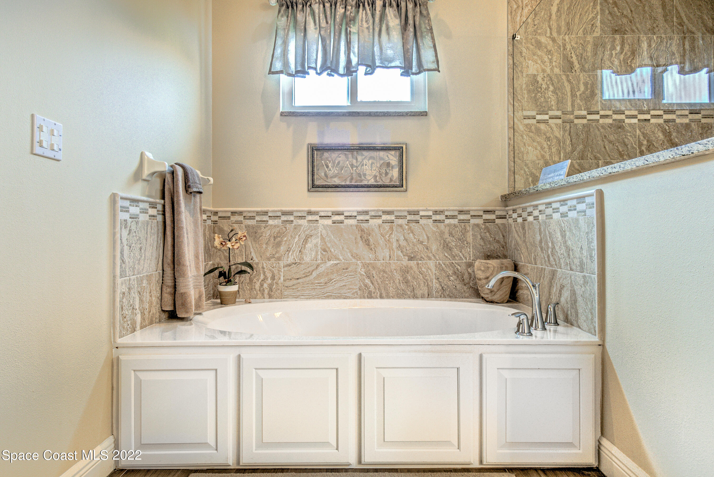 3415 Shady Run Road Melbourne, FL 32934 - Photo 10 of 45 a bathroom with a sink and a mirror