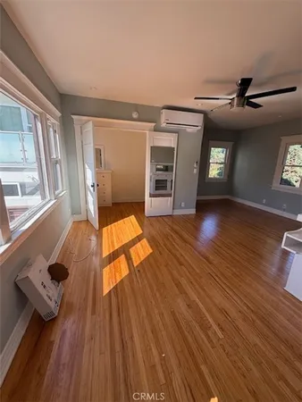 a view of an empty room and wooden floor