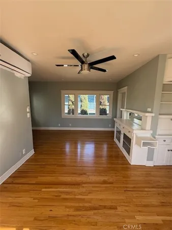 a view of a kitchen with a sink and microwave