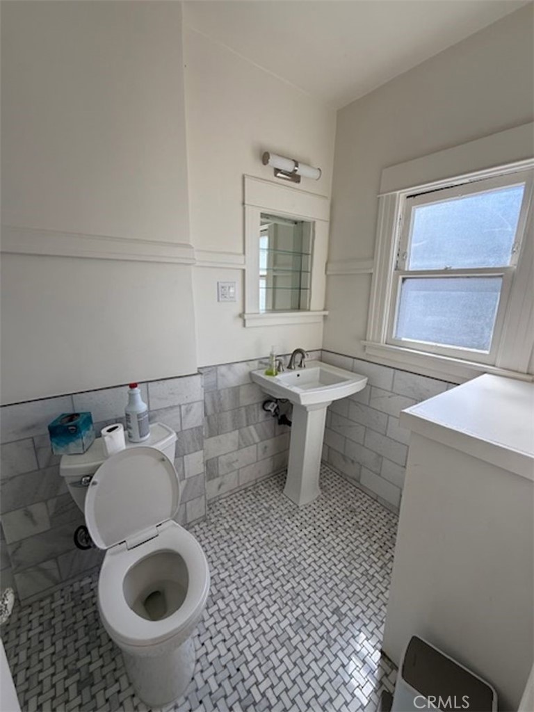 4603 East Broadway Long Beach, CA 90803 - Photo 7 of 7 a bathroom with a sink and a mirror