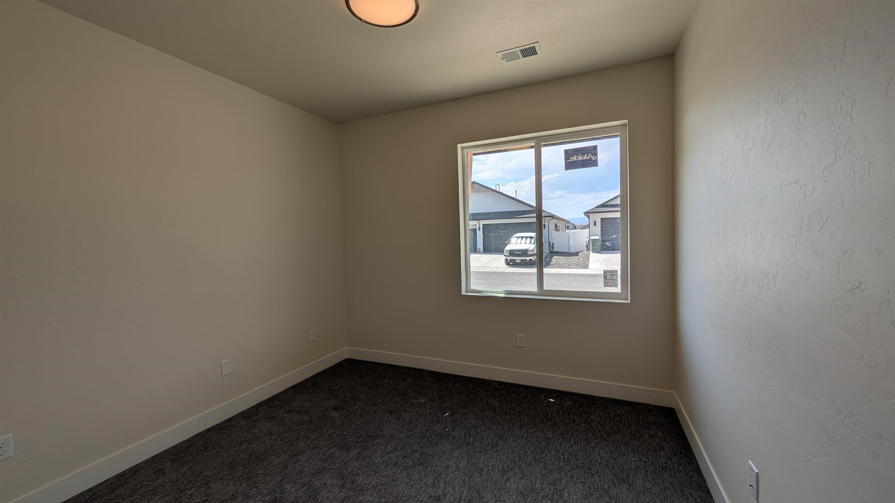 2452 Hamilton Road, Unit A Grand Junction, CO 81505 - Photo 6 of 13 an empty room with a window