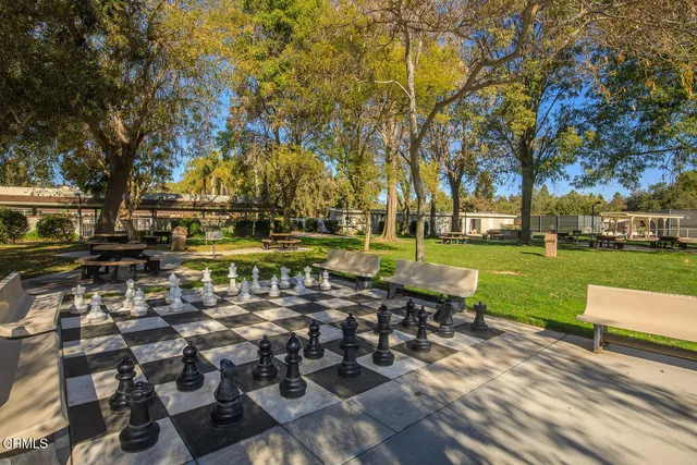 a view of pool and trees in the background