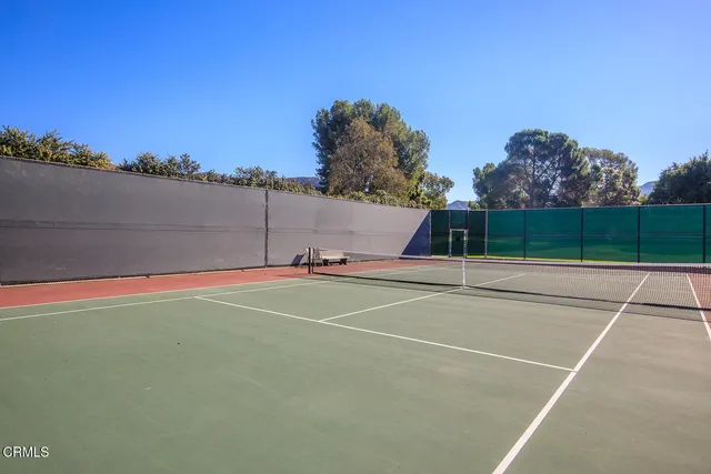 a view of a livingroom with furniture and natural light