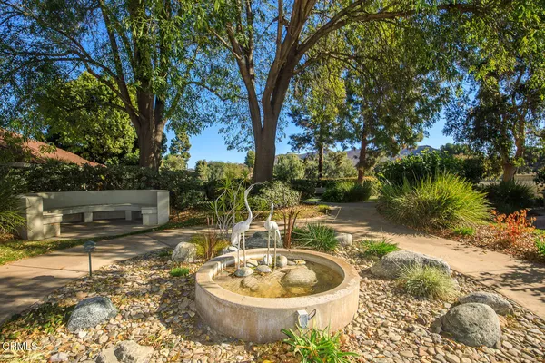 a room with pool table and windows