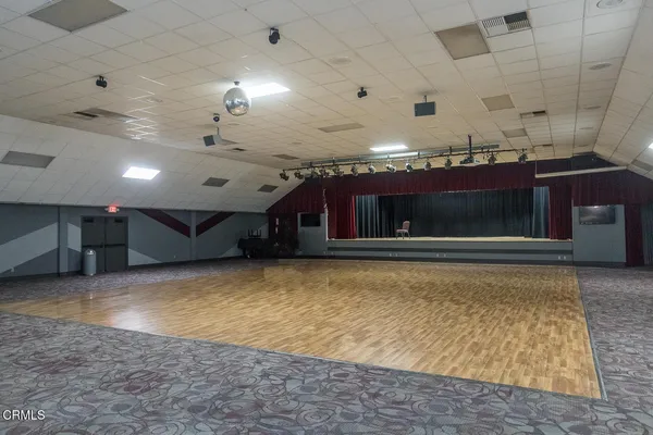 a indoor swimming pool table and chairs
