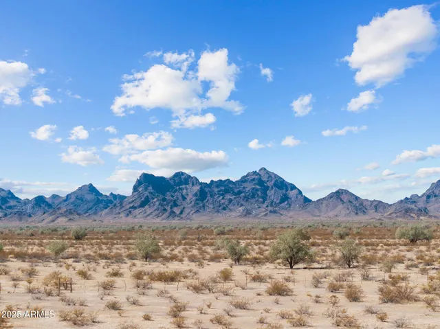 a view of mountain with sunset