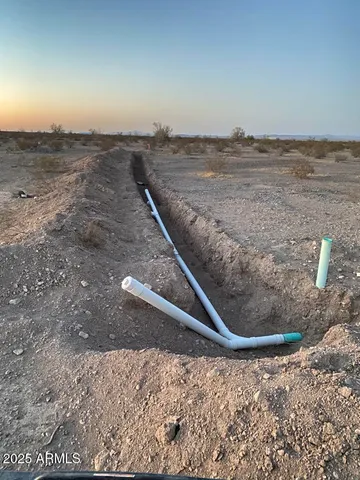 a view of a pathway with a lake in the background