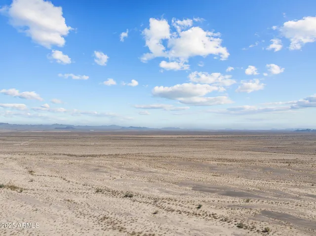 a view of mountain and a yard