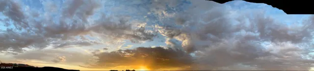 a view of a dry yard with mountain