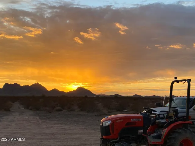 a view of sunset and a mountain